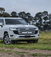 Load image into Gallery viewer, Toyota 300 Series Land Ultra Vision Cruiser Behind Grille Light Bar Kit
